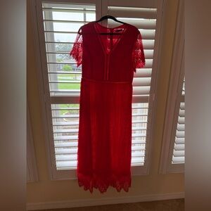 Beautiful Red Lace Maxi Dress with lace sleeves with intricate detailing.